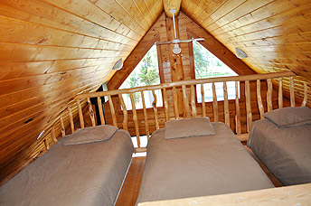 Three beds in the upstairs loft.